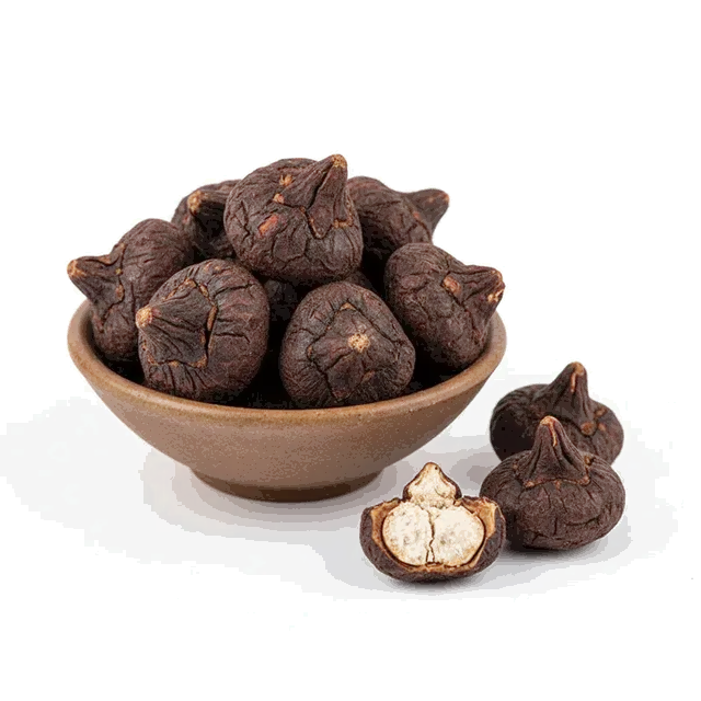 Sun-dried whole singhara in a wooden bowl
